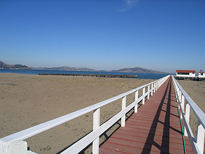 Pier in foreground, breakwater in the center of the frame—facing northeast.