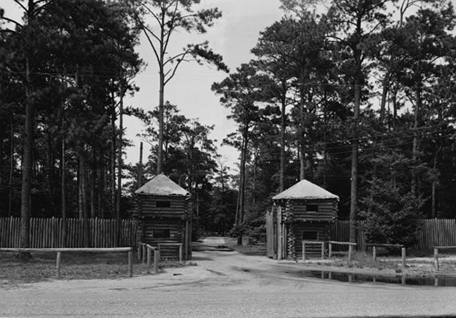 Fort Raleigh entrance showing two log blockhouses, 1930s