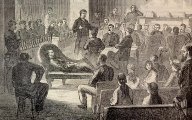 A newspaper drawing of the courtroom, showing Captain Wirz reclining on a couch. NPS/Andersonville National Historic Site