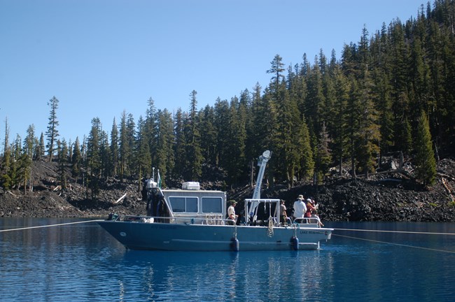 Biologists aboard research vessel in Crater Lake