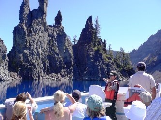 Visitors and ranger in a boat on Crater Lake