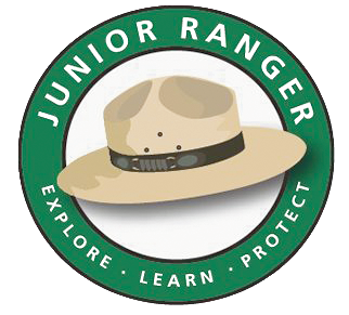 An illustration of a ranger hat surrounded by the words, Junior Ranger, Explore, Learn, Protect.