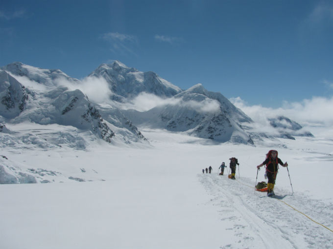 Skiers moving up the glacier at 9,000-feet