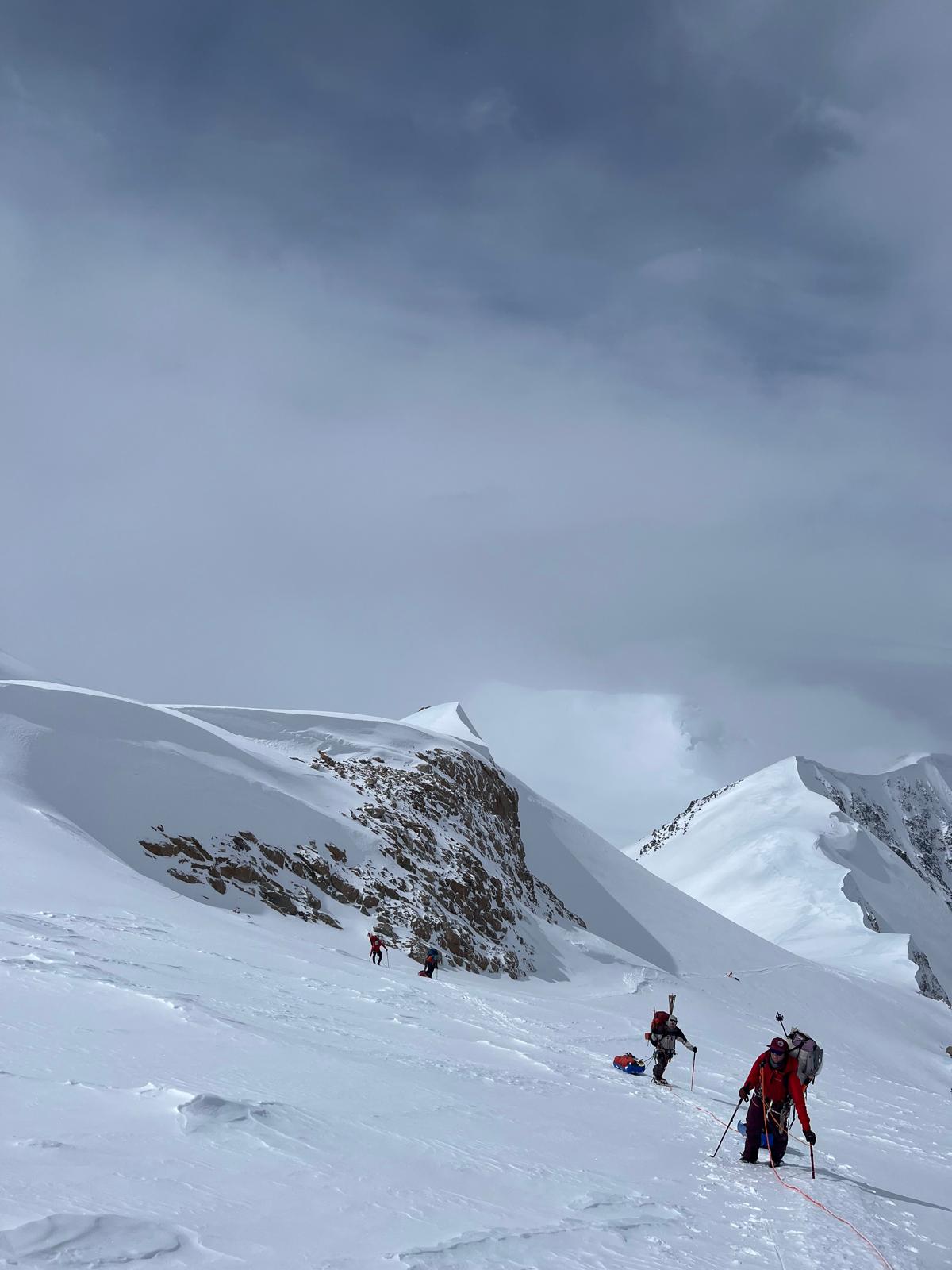 West Buttress Patrol #1 passing Squirrel Hill on their move from 11 camp to 14 camp and enjoying a reprieve from the stormy weather.