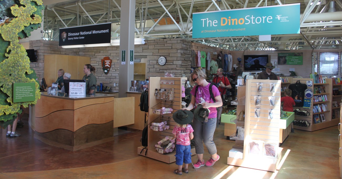 Visitors explore products inside the Dino Gift Store