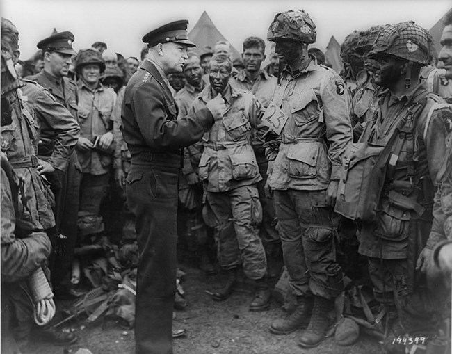 General Eisenhower Speaks To Soldiers of the 101st Airborne who are preparing for DDay, dressed in army uniforms