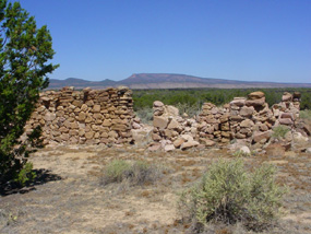 A homestead sits next to a lava flow
