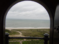 View from atop the Fire Island Lighthouse, looking through arched doorway.