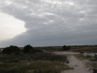 Storm clouds over island.