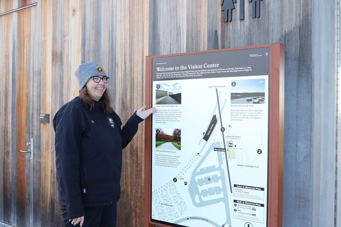 SCA Chloe and the sign she designed to help orient visitors at Flight 93 National Memorial.
