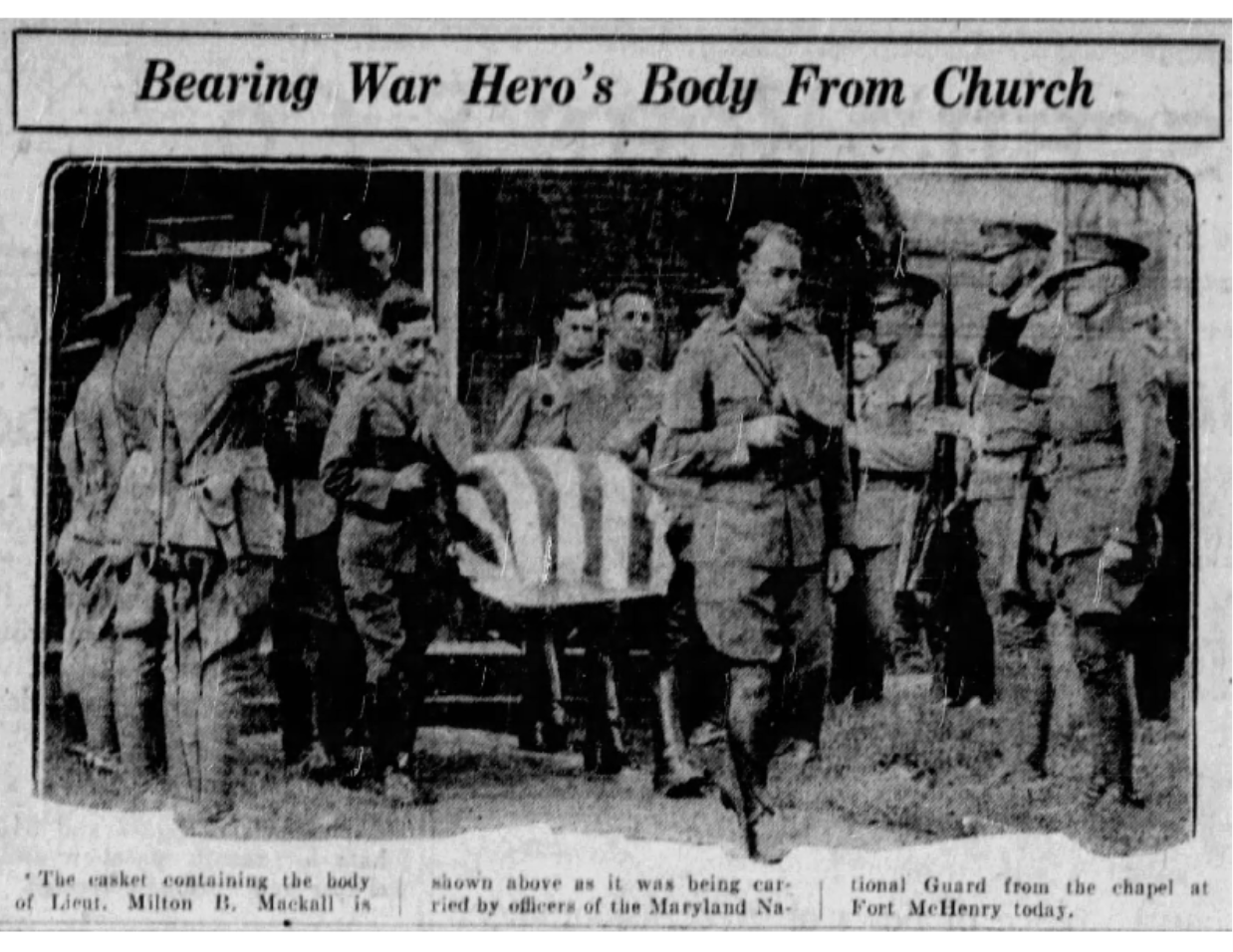 A black and white newspaper clipping showing soldiers carrying a coffin with an American flag on it with the headline "Bearing War Hero's Body From Church."