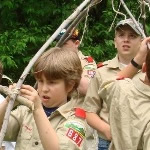 Scouts building wigwam