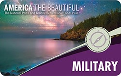 Front of the Military Annual Pass has text and an image shwoing a lake shore at night.