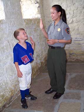 young boy being sworn in as a junior park ranger