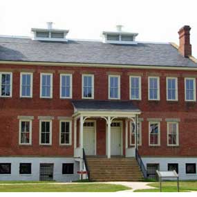 The barracks/courthouse building as it looks today with the second floor that was added in 1890.