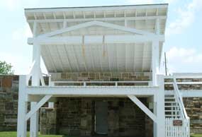 photo of gallows showing two nooses hanging from cross beam