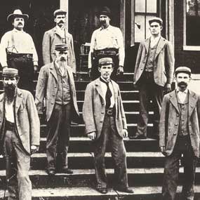 jailers in uniform on courthouse steps