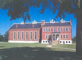 east side of Visitor Center with bright blue sky behind it