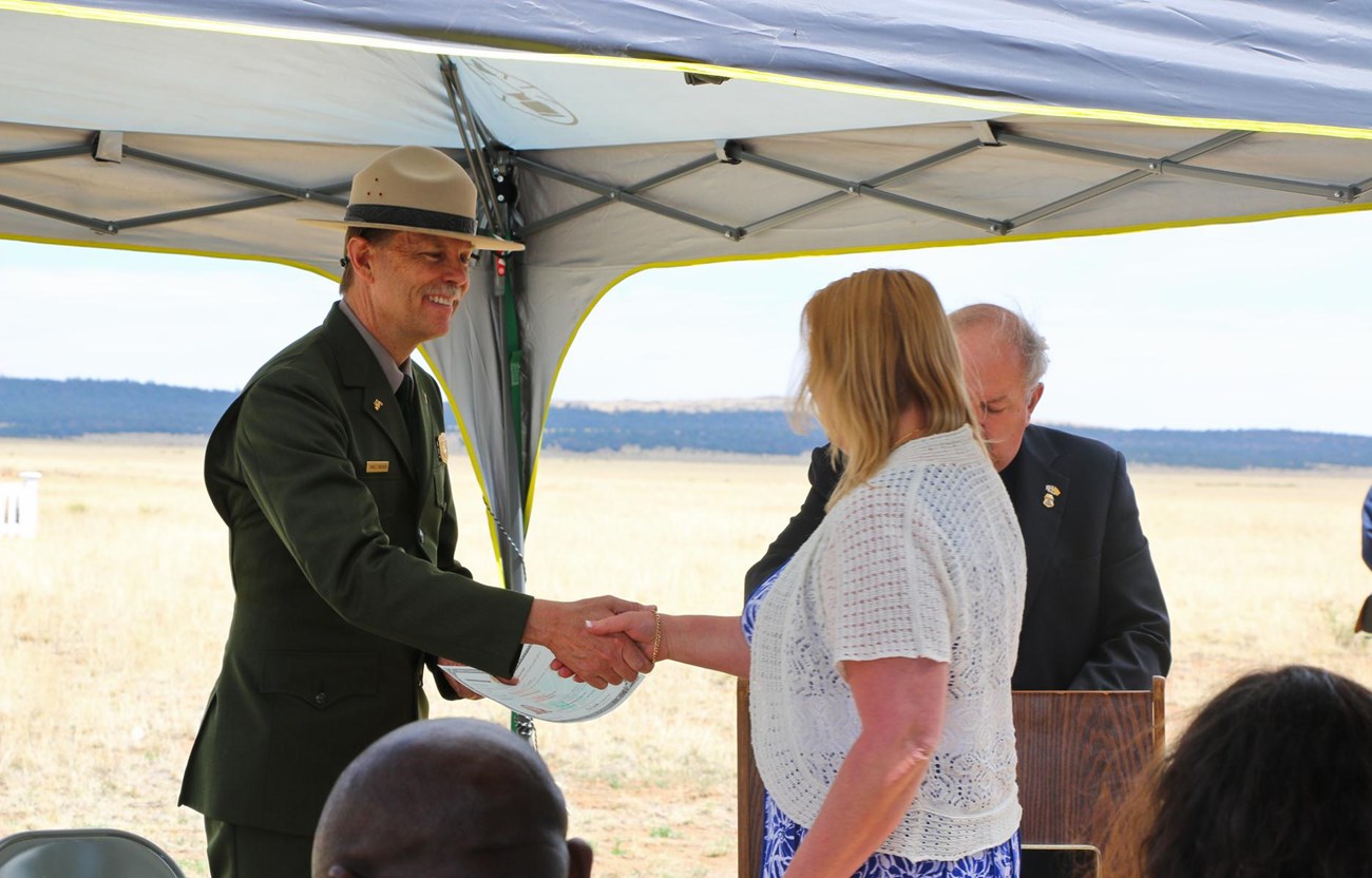 2014 Naturalization ceremony at Fort Union National Monument. Superintendent shaking hands.