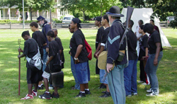 Photo of Park Rangers with participants of the annual Summer Rites of Passage Program