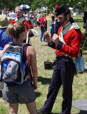 A volunteer interacts with the public at a special event