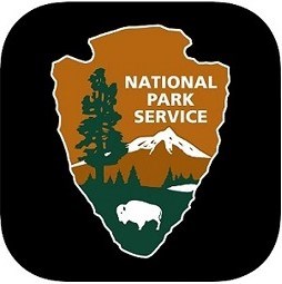 Black background with NPS logo of arrowhead with tree mountain and buffalo