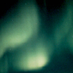 Green northern lights filling the sky.