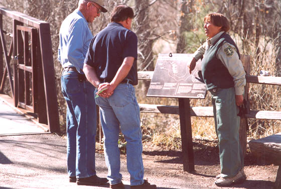 Employee giving visitors an orientation