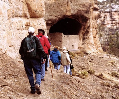 Visitors approaching the ruins on tour.