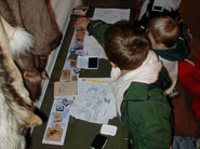 Children stamping habitat papers