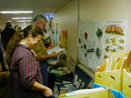 Teachers looking at education trunks.