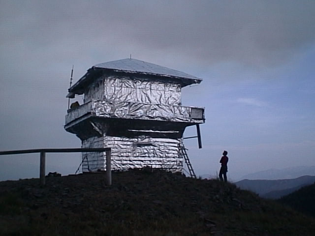 Huckleberry Lookout wrapped with protective foil which saved it from burning in the 2001 Moose Fire.