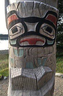 The bottom of the healing totem pole depicts clan houses and the great glacier spirit