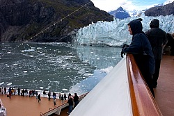 Cruise ship passenger views glacier from upper deck.