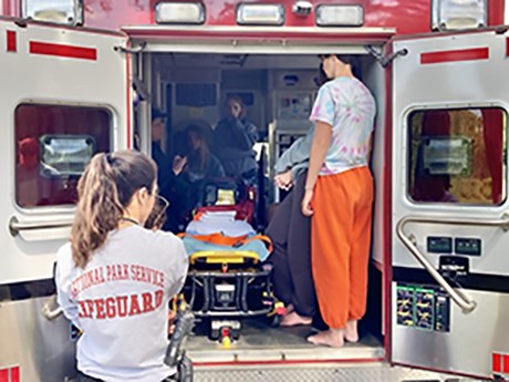 Junior lifeguards receive an orientation to an ambulance.