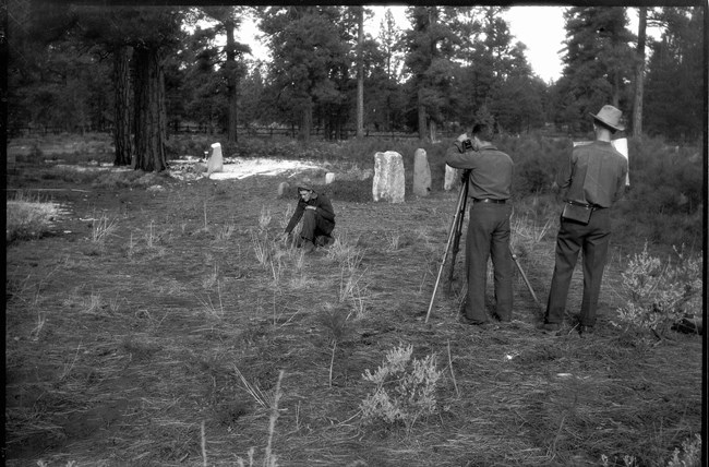 CCC surveying and staking grave plots in the pioneer cemetery.