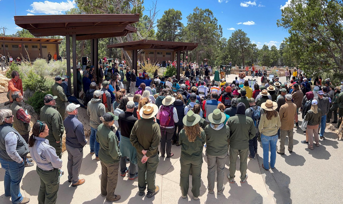A crowd of several hundred gather at the Bright Angel Trailhead to rededicate Havasupai Gardens.