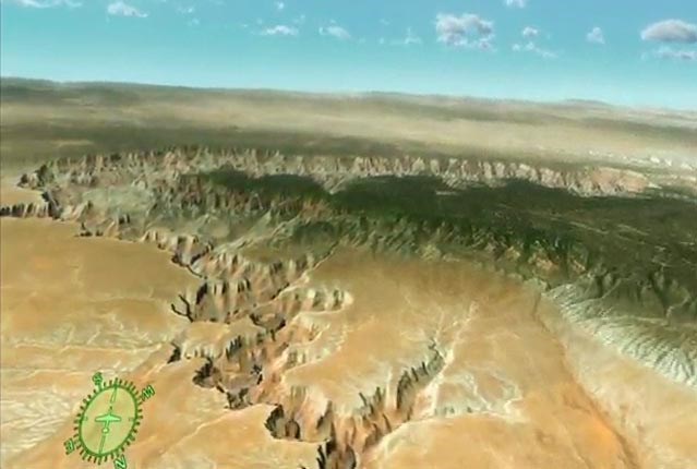 A computer generated view of a desert canyon, with a forested plateau in the distance.