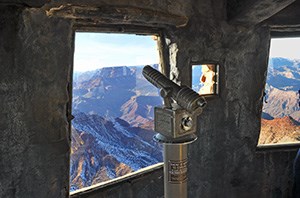 Telescope and windows on the observation level of the watchtower.