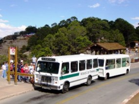 visitors boarding free shuttle bus