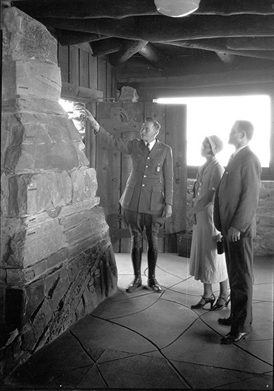 Ralph Reburn shows visitors the geological column