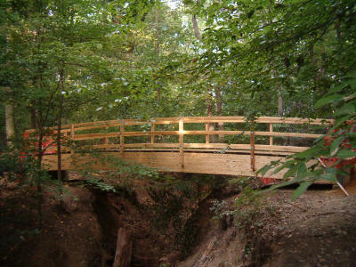 a picture of the new bridge on the perimeter trail crossing a creek