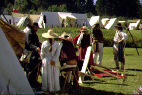 Historical reenactors catch up on news during Rendezvous Days.
