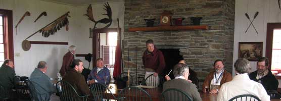 Volunteers reenact a partners business meeting of the famed North West Company in the Great Hall at Grand Portage during Rendezvous Days.