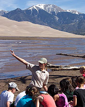 Student Conservation Association volunteer with students
