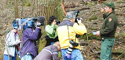 Reporters interview a park ranger.