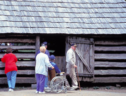 Visitors touring historic structure in park