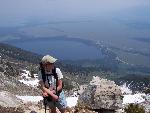 hiker on Apex Trail, Teewinot, valley below