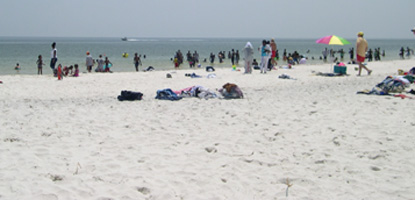 Visitors congregate on the white sandy beaches or swim in the Gulf of Mexico.