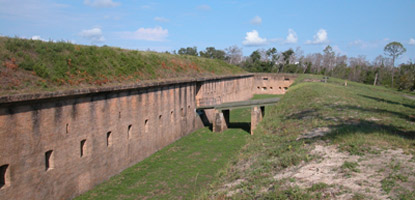 The drawbridge at Fort Barrancas crosses over a dry moat. The drawbridge at Fort Barrancas crosses over a dry moat.